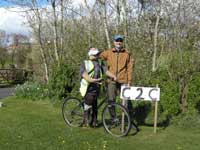 Cycling scarecrow and friend